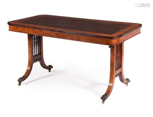 A GEORGE IV SATINWOOD AND FUSTIC MAHOGANY LIBRARY TABLE IN T...