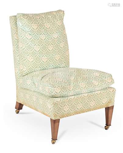 A BEECH AND UPHOLSTERED 'HOWARD' CHAIR, BY LENYGON & MORANT,...