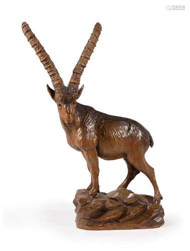 A SWISS 'BLACK FOREST' CARVED PINE MODEL OF A MALE IBEX, LAT...