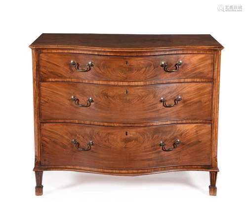 A GEORGE III MAHOGANY SERPENTINE FRONTED DRESSING CHEST OF D...