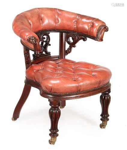 A VICTORIAN MAHOGANY AND RED LEATHER UPHOLSTERED DESK ARMCHA...