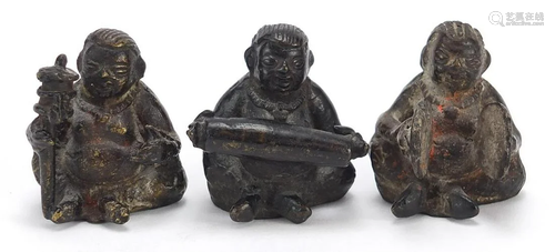 Three Chinese bronzes of musicians seated playing