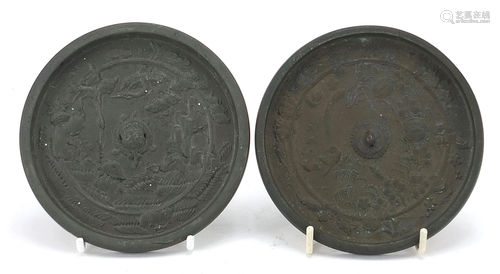 Two Japanese bronzed hand mirrors cast with birds of