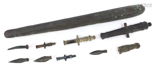 Metal antiquities including spear heads and cannon