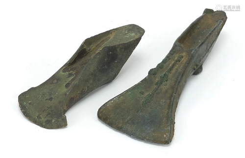 Two antique patinated bronze axe heads, the largest