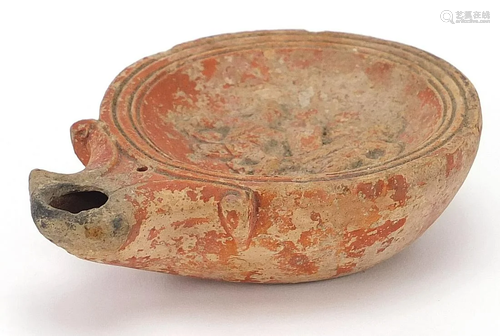 Roman terracotta oil lamp decorated in relief with two