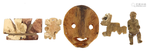 Antiquities including a carved bone face mask, the