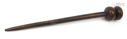Tribal interest hardwood throwing stick carved with a