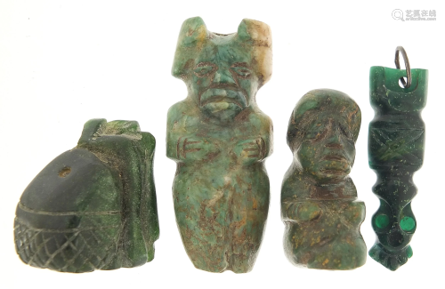 Four antique green stone carvings including a Hei-tiki
