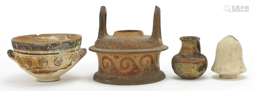 Four Greek pottery vessels, one with twin handles and