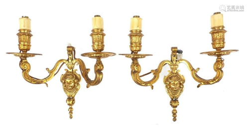 Pair of French style two branch gilt metal wall sconces