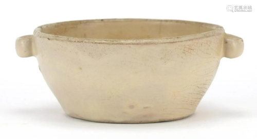 Asian celadon glazed bowl with twin handles, possibly