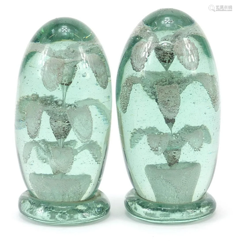 Two Victorian green glass dumps with flowers to the