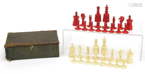 Half stained carved bone chess set, the largest piece