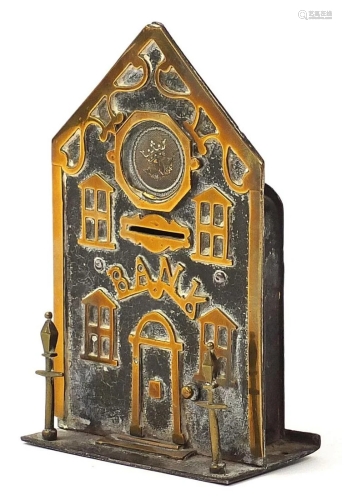 19th century brass money bank in the form of a building