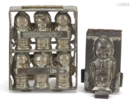Two continental cast metal chocolate moulds of children