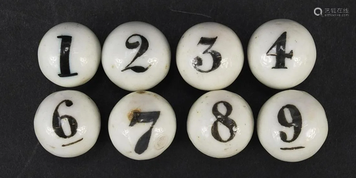 Eight Victorian porcelain numbered balls, each