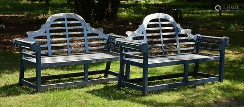 A PAIR OF HARDWOOD GARDEN BENCHES, AFTER A DESIGN BY LUTYENS...