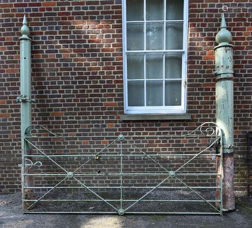 A LARGE VICTORIAN WROUGHT IRON ESTATE GATE WITH CAST IRON PO...