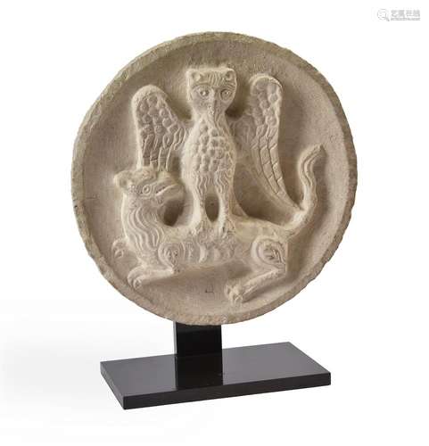 A LIMESTONE ROUNDEL OF AN OWL AND A LION, POSSIBLY 19TH CENT...