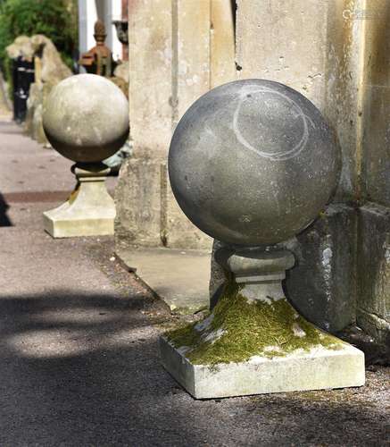 A LARGE PAIR OF COMPOSITION STONE BALL FINIALS, 20TH CENTURY