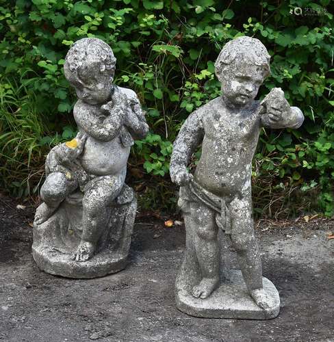 A PAIR OF COMPOSITION STONE MODELS OF CHERUBS, ATTRIBUTED TO...