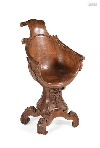 AN ITALIAN CARVED WALNUT 'GROTTO' CHAIR, SECOND QUARTER 19TH...