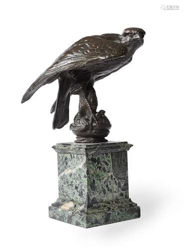 A FRENCH BRONZE MODEL OF AN EAGLE WITH A SNAKE, MID 19TH CEN...