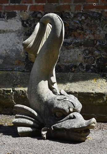 A COMPOSITION STONE MODEL OF A DOLPHIN, IN THE MANNER OF SEE...