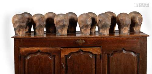 A GROUP OF TWELVE MILLINER'S HEADS, LATE 18TH/EARLY 19TH CEN...