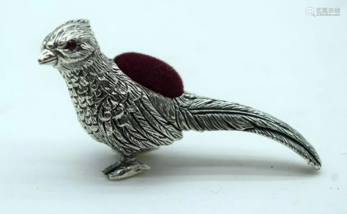 A sterling silver pin cushion in the form of a pheasant