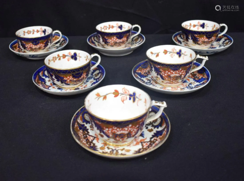 A collection of Derby tea cups and saucers (12).