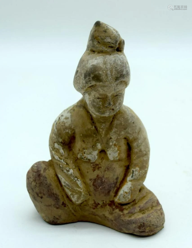 A Chinese Tang terracotta figure of a seated female