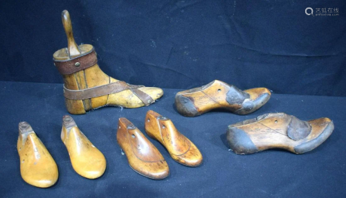 A collection of antique wooden shoe lasts 25cm (7).