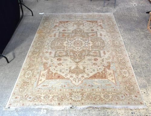 A large ivory ground Oriental rug. 277 x 184cm