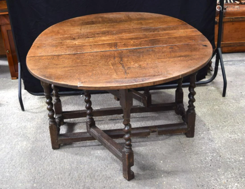 A large antique Gateleg wooden dining table. 72 x 145 x