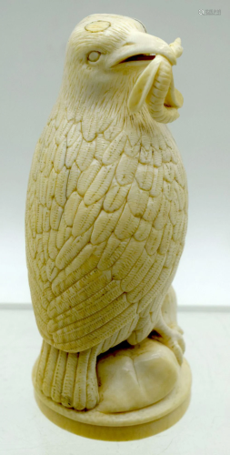A European Ivory figure of a bird on a stand. 13cm. (2)