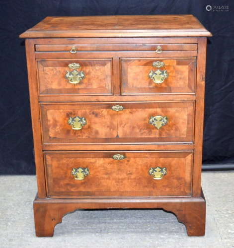 A small antique Burr wood inlaid four drawer chest with