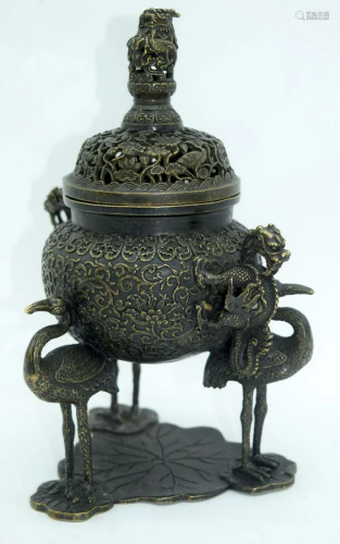 A Chinese bronze lidded incense burner lavishly