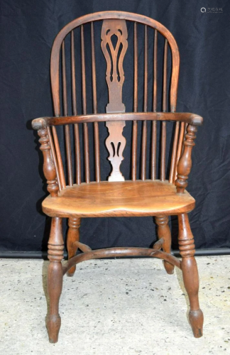 A 19th century wooden Windsor chair. 104 x 49cm