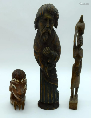 A wooden religious figure together with two other
