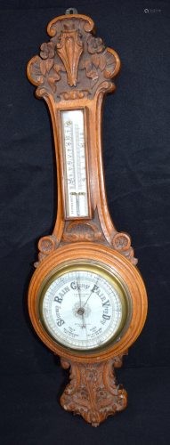 An antique wooden Hughes & Son barometer. 67cm