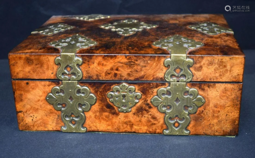A lovely antique Burr wood box with brass decorations