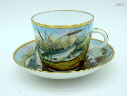 A hand painted porcelain cup & saucer, depicting a