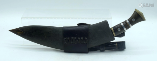 A 20th Century horn handled Kukri with two smaller
