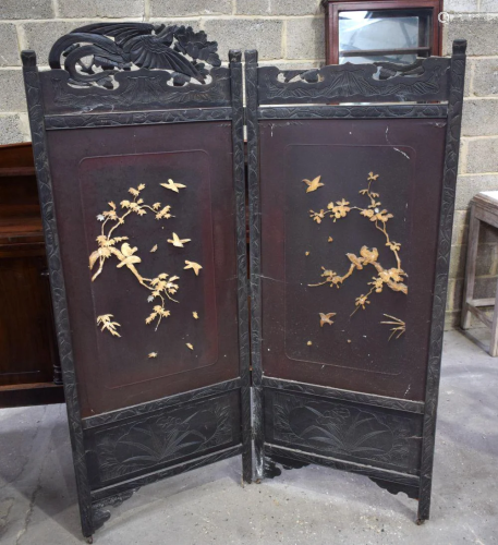 A large Japanese wooden screen decorated with birds