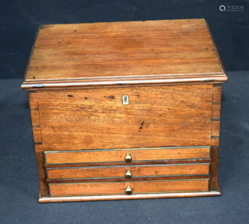 An antique small 3 drawer, top opening cabinet.