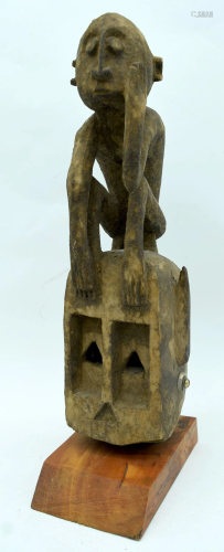 An African tribal Dogon Omino Mask set on a stand. 35cm