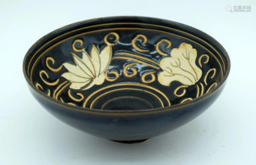 A small Chinese Jia ware bowl decorated with flowers