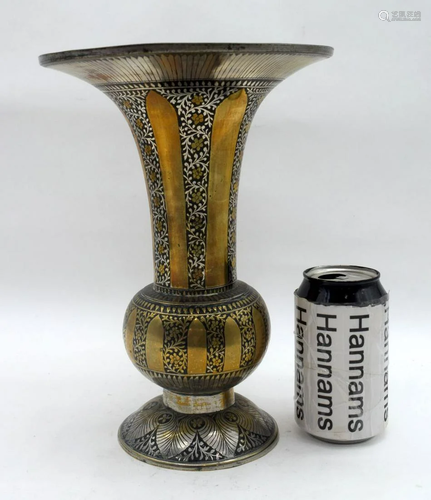 A Middle Eastern copper and white metal fluted vase